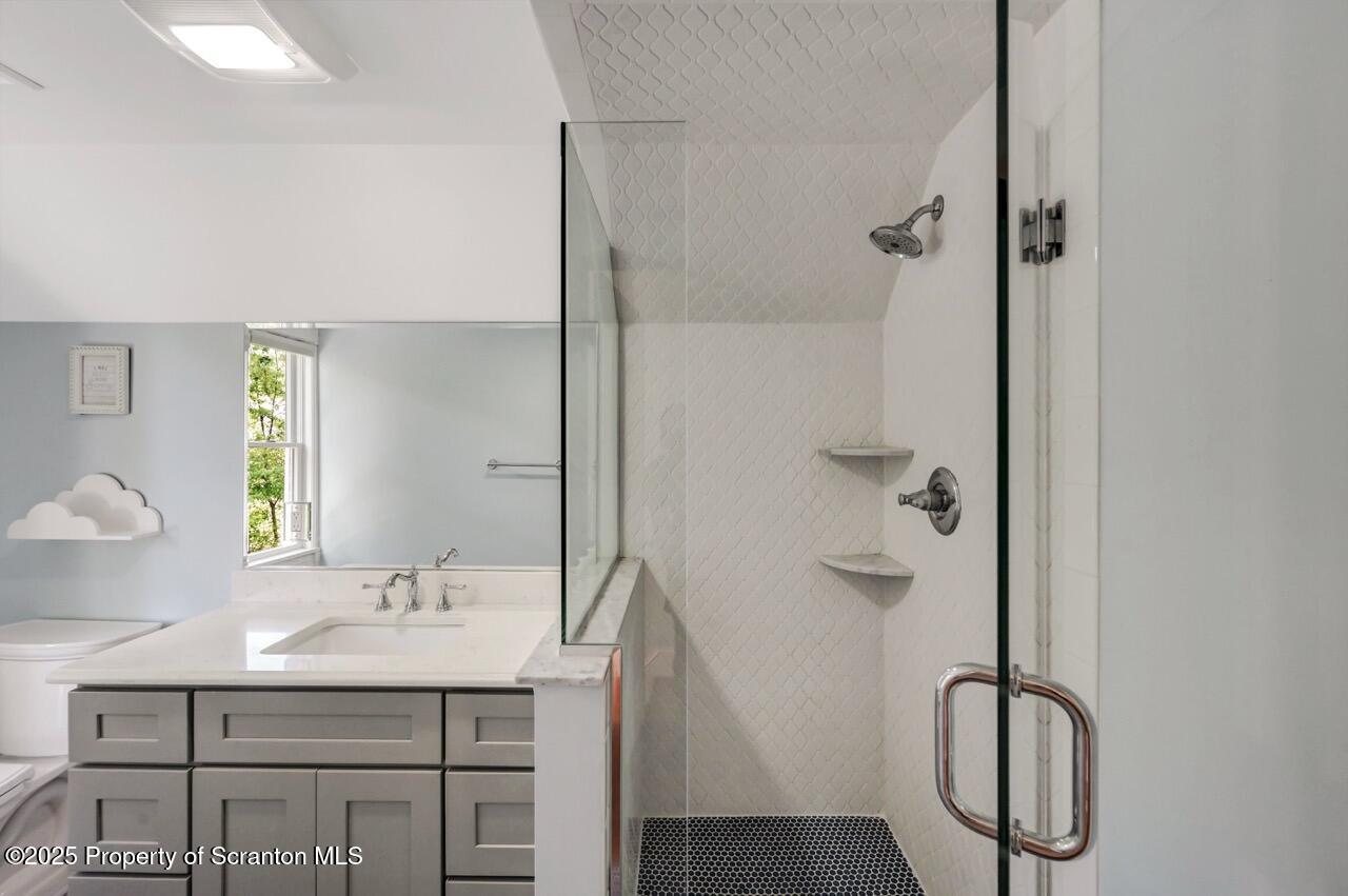 215 Fairview Road Clarks Green, PA 18411 - Photo 67 of 148 a bathroom with a granite countertop sink a mirror and a shower