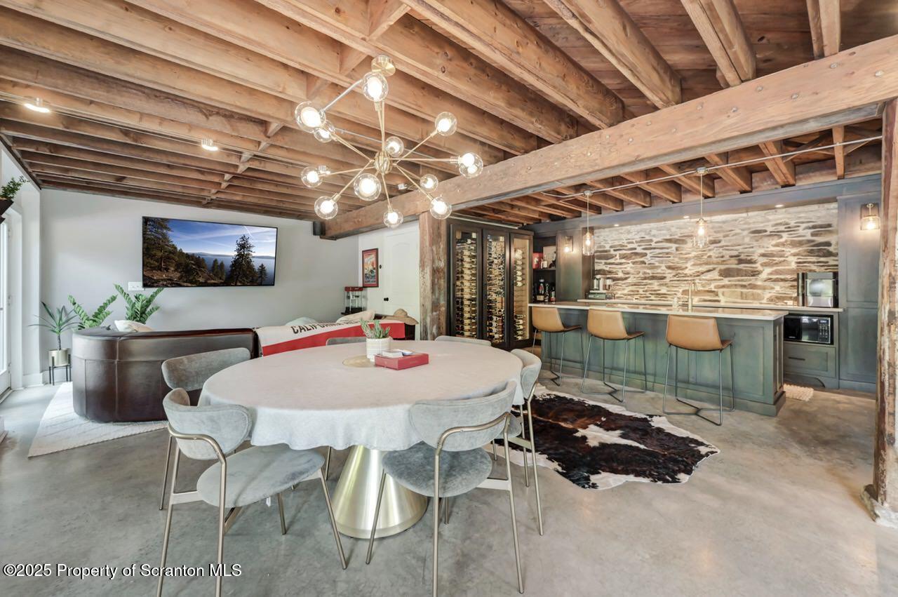 215 Fairview Road Clarks Green, PA 18411 - Photo 92 of 148 a view of a room with furniture and a chandelier