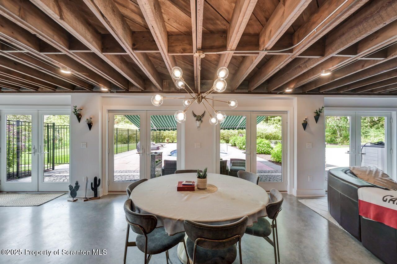 215 Fairview Road Clarks Green, PA 18411 - Photo 95 of 148 a view of a dining room with furniture a chandelier and wooden floor