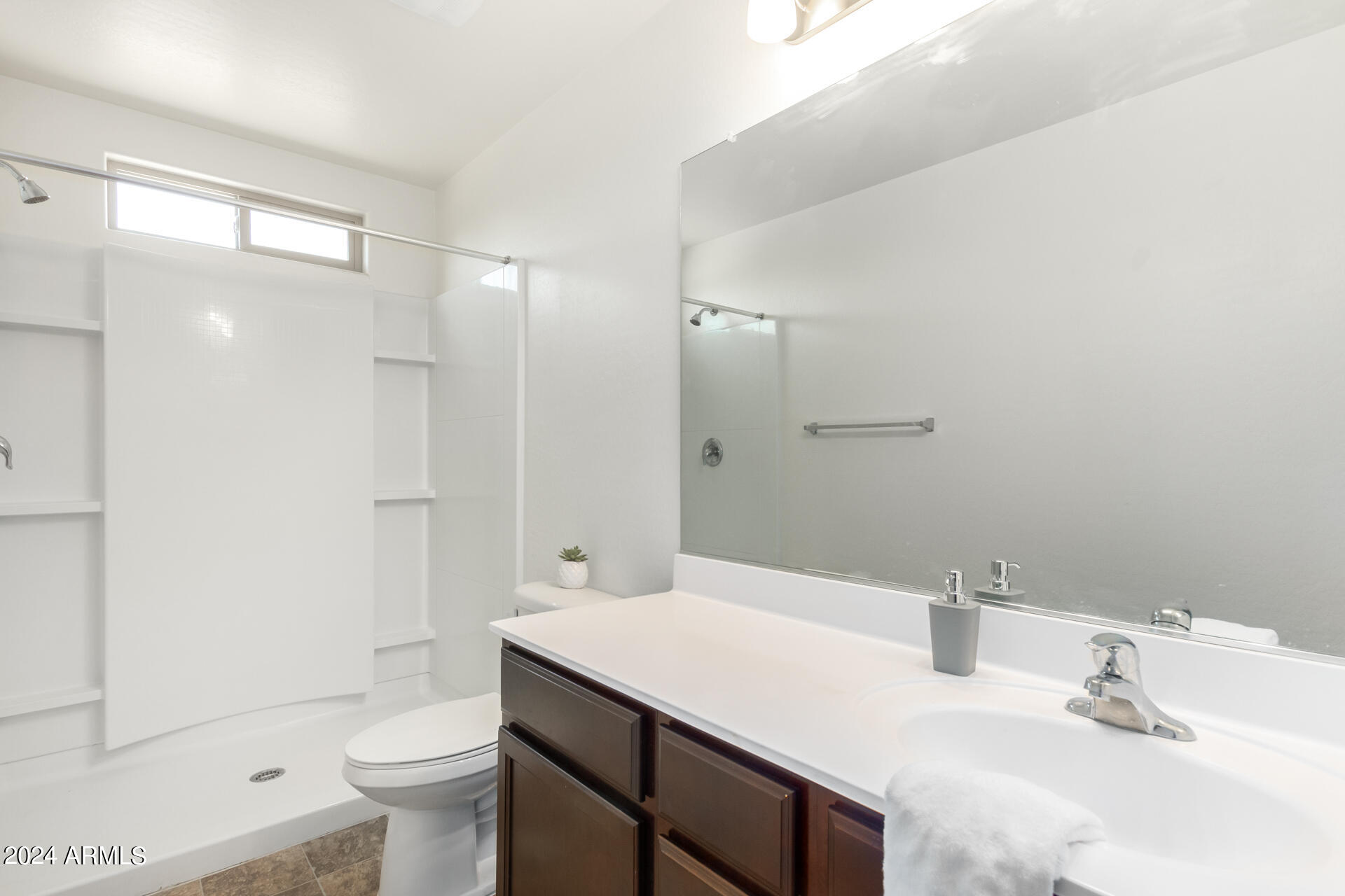 1832 South Hayley Road Apache Junction, AZ 85119 - Photo 13 of 30 a bathroom with a sink toilet double vanity and shower