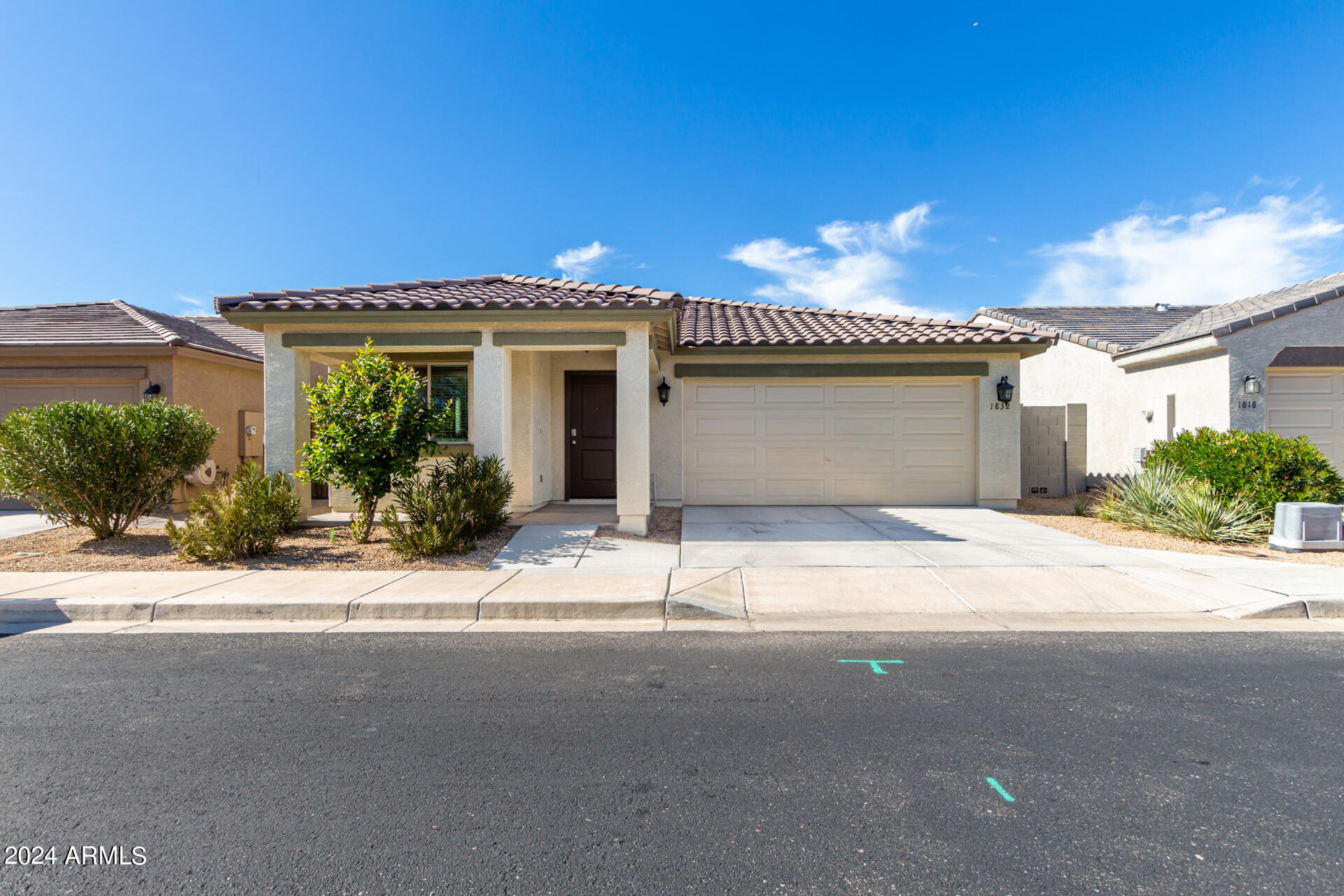 1832 South Hayley Road Apache Junction, AZ 85119 - Photo 8 of 30 a front view of a house with a yard and garage