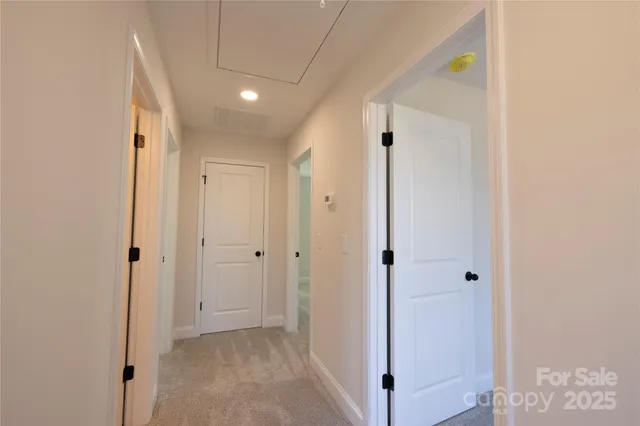 a view of a hallway with closet and entryway