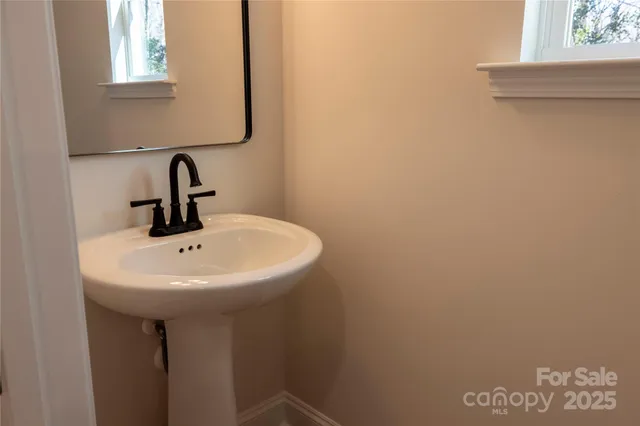 a bathroom with a sink and mirror