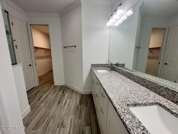 a bathroom with a glass shower door
