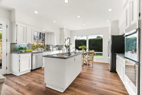 a view of a dining room with furniture window and outside view