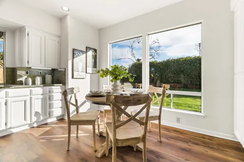 a kitchen with stainless steel appliances granite countertop a stove and a refrigerator