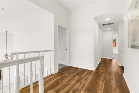 a bed room with a bed and a chandelier