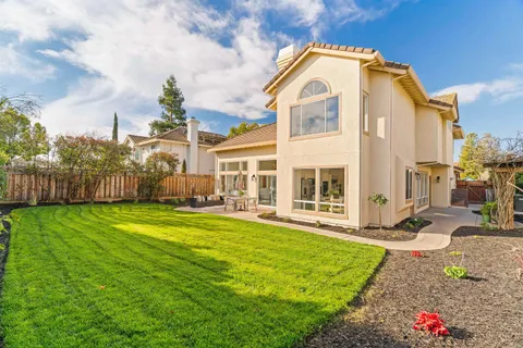 a view of a bench in patio of a house