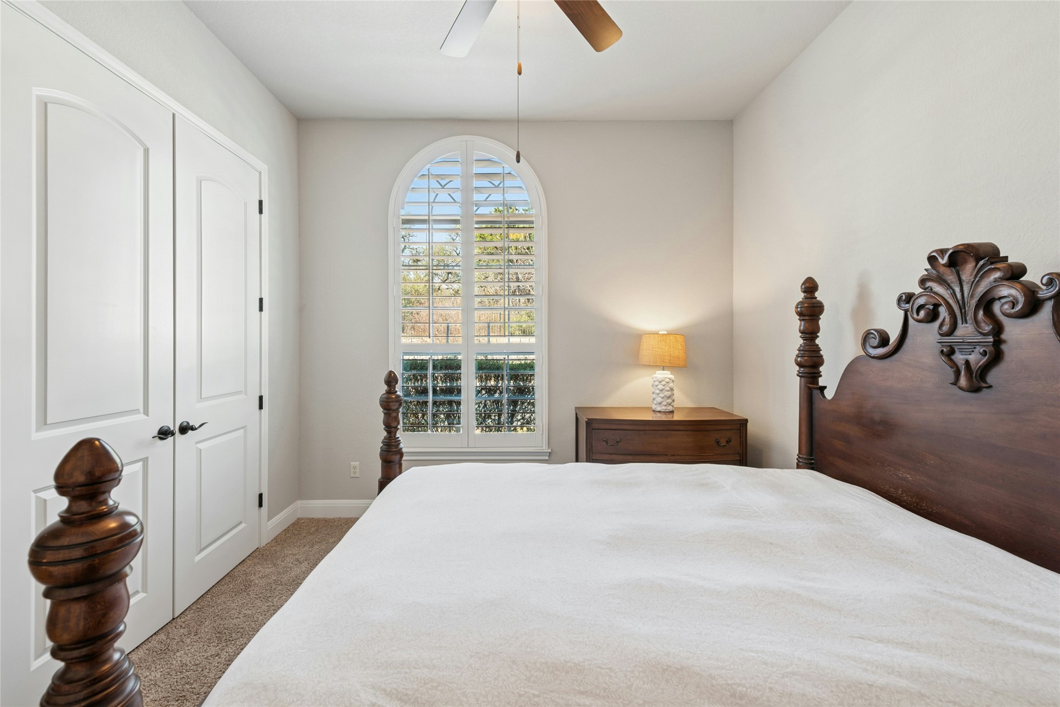 116 Evolutions Path Lakeway, TX 78738 - Photo 23 of 34 Bedroom featuring light carpet, a ceiling fan, and a closet
