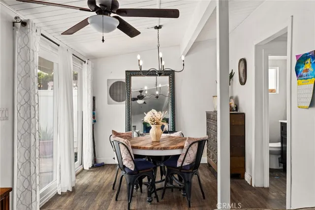 a dining room with furniture and chandelier