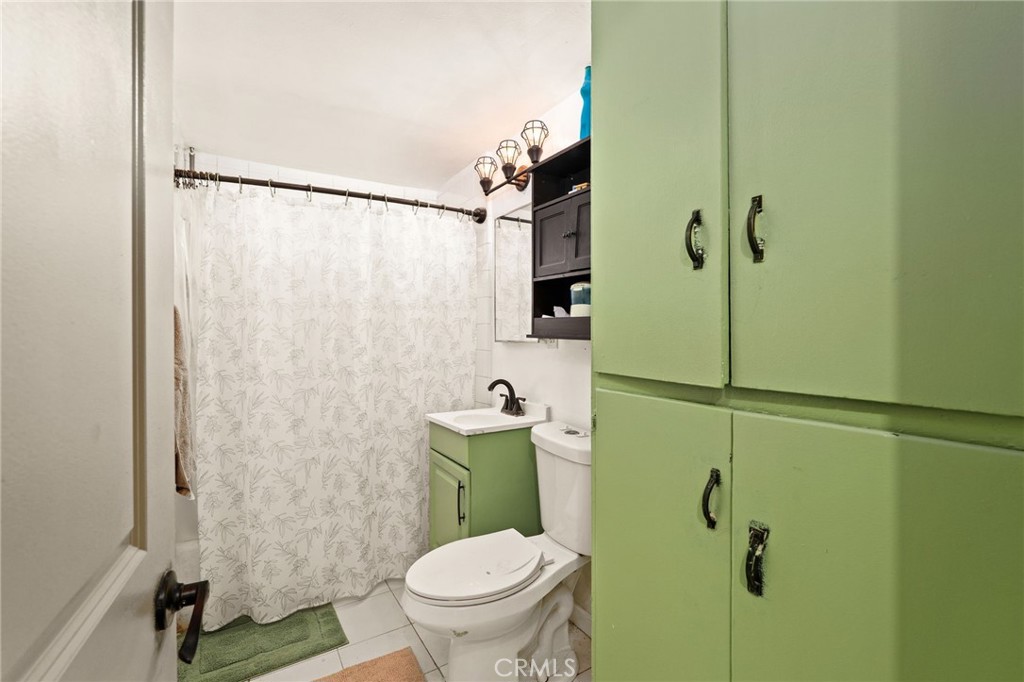 5208 North Leaf Azusa, CA 91702 - Photo 16 of 34 a bathroom with a toilet and a shower