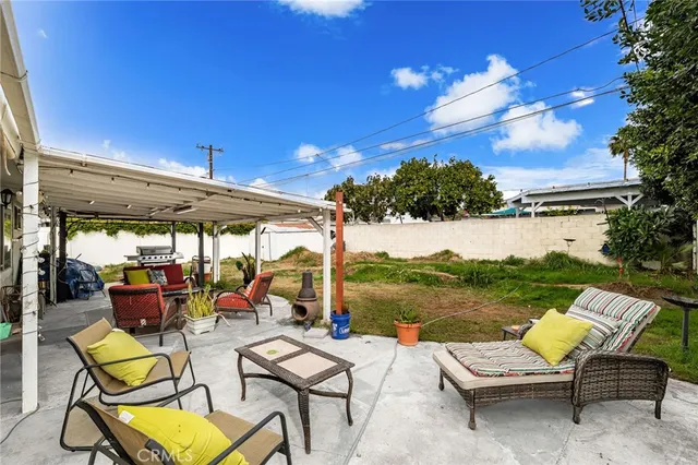 a view of swimming pool with outdoor seating yard and mountain view in back