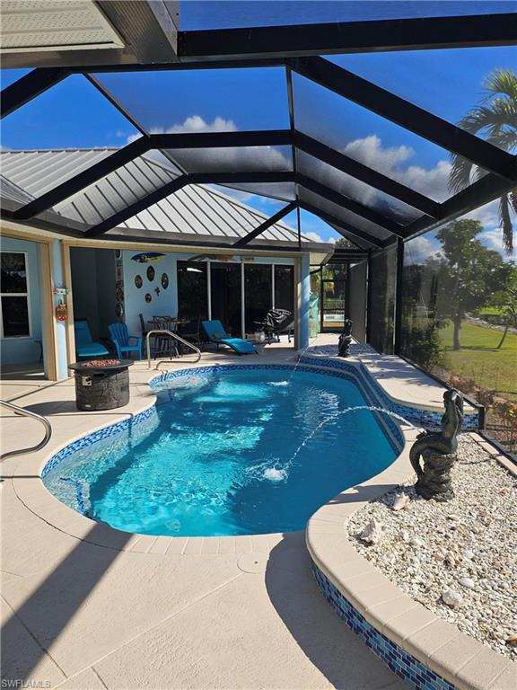 7791 Grande Pine Road Bokeelia, FL 33922 - Photo 10 of 45 a view of a backyard with swimming pool