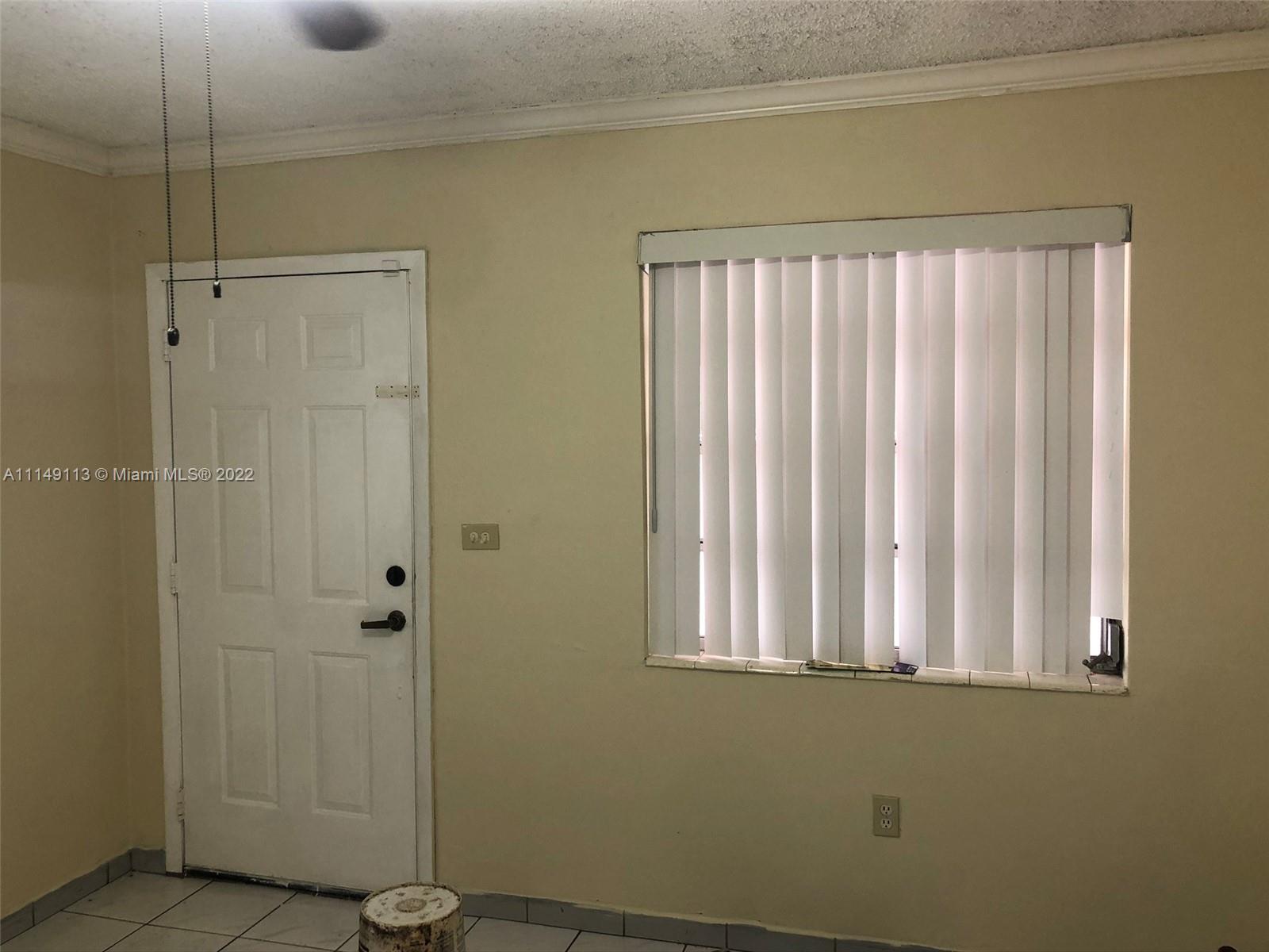 1709 Northwest 22nd Court Miami, FL 33125 - Photo 3 of 7 a bathroom with a shower