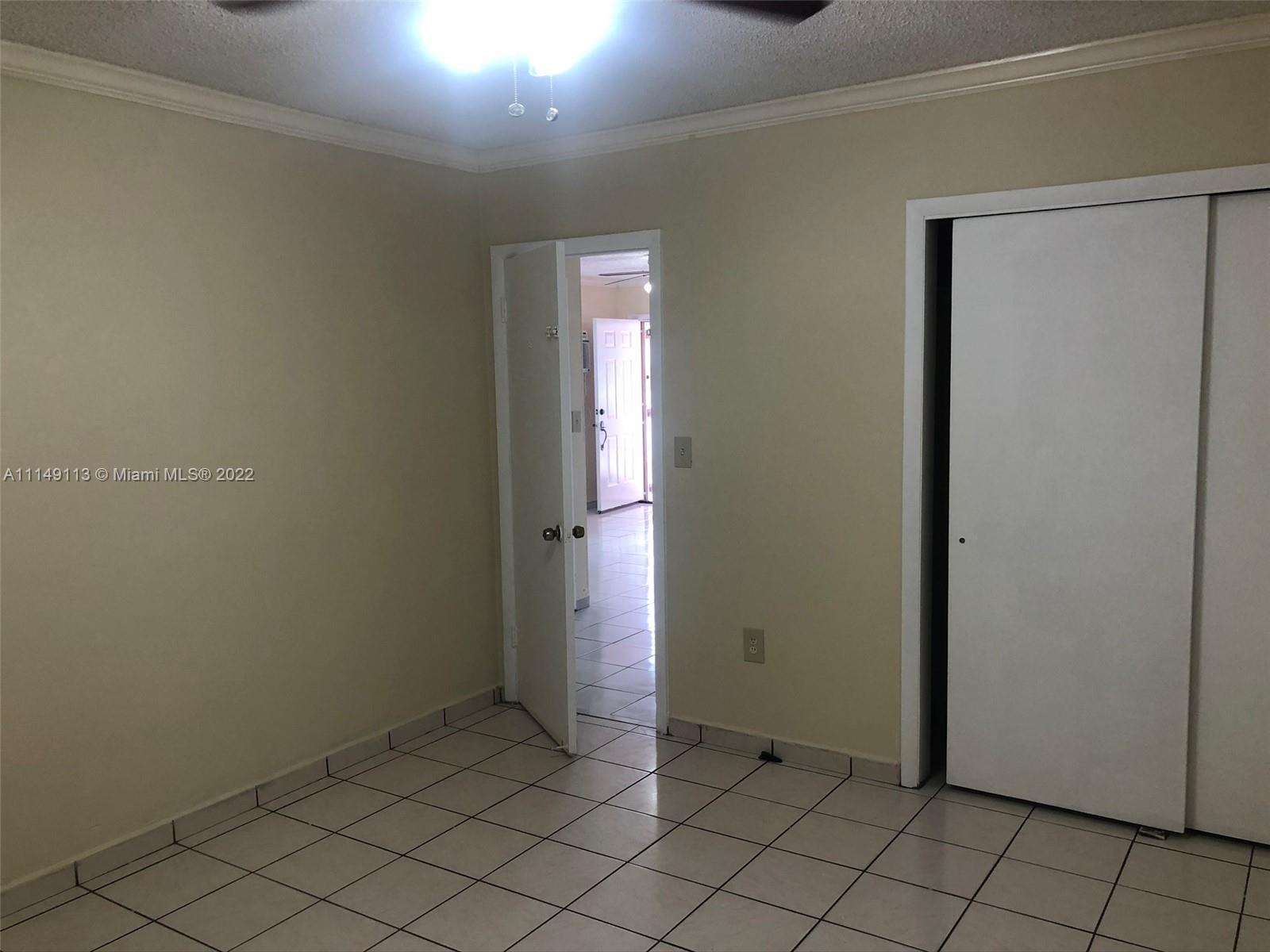 1709 Northwest 22nd Court Miami, FL 33125 - Photo 6 of 7 a view of an empty room and window