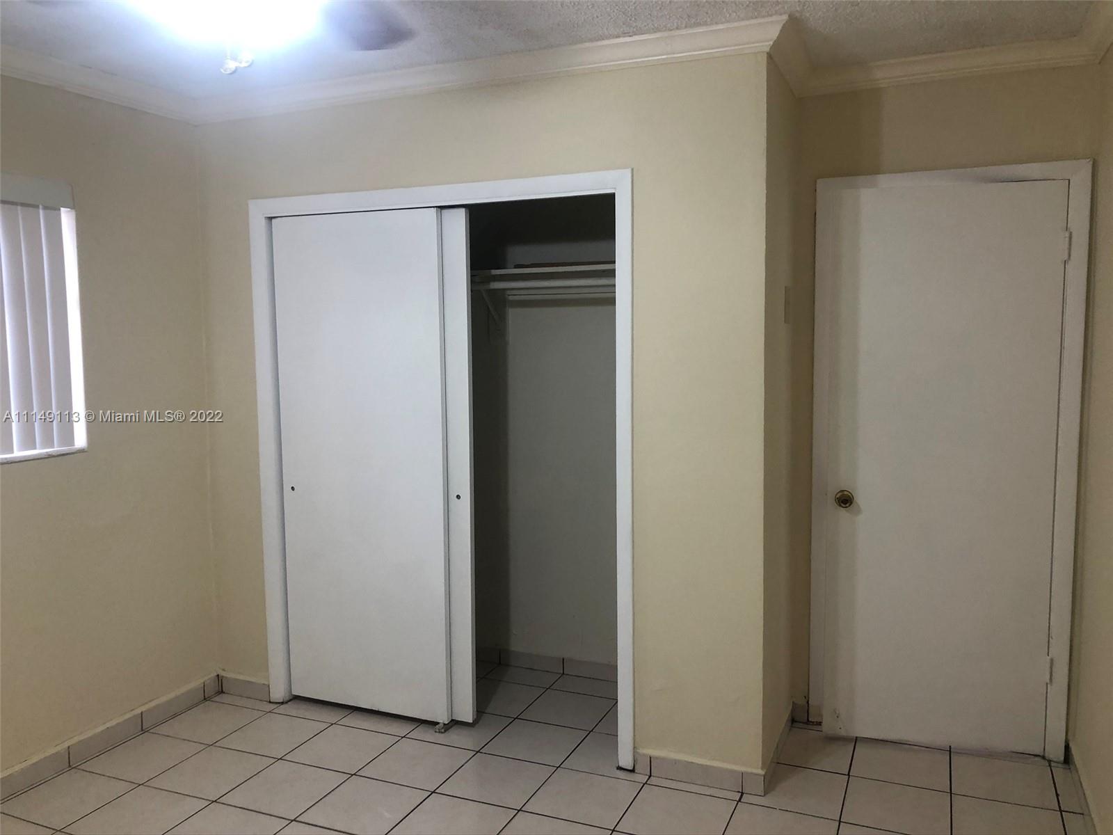 1709 Northwest 22nd Court Miami, FL 33125 - Photo 7 of 7 a view of an empty room