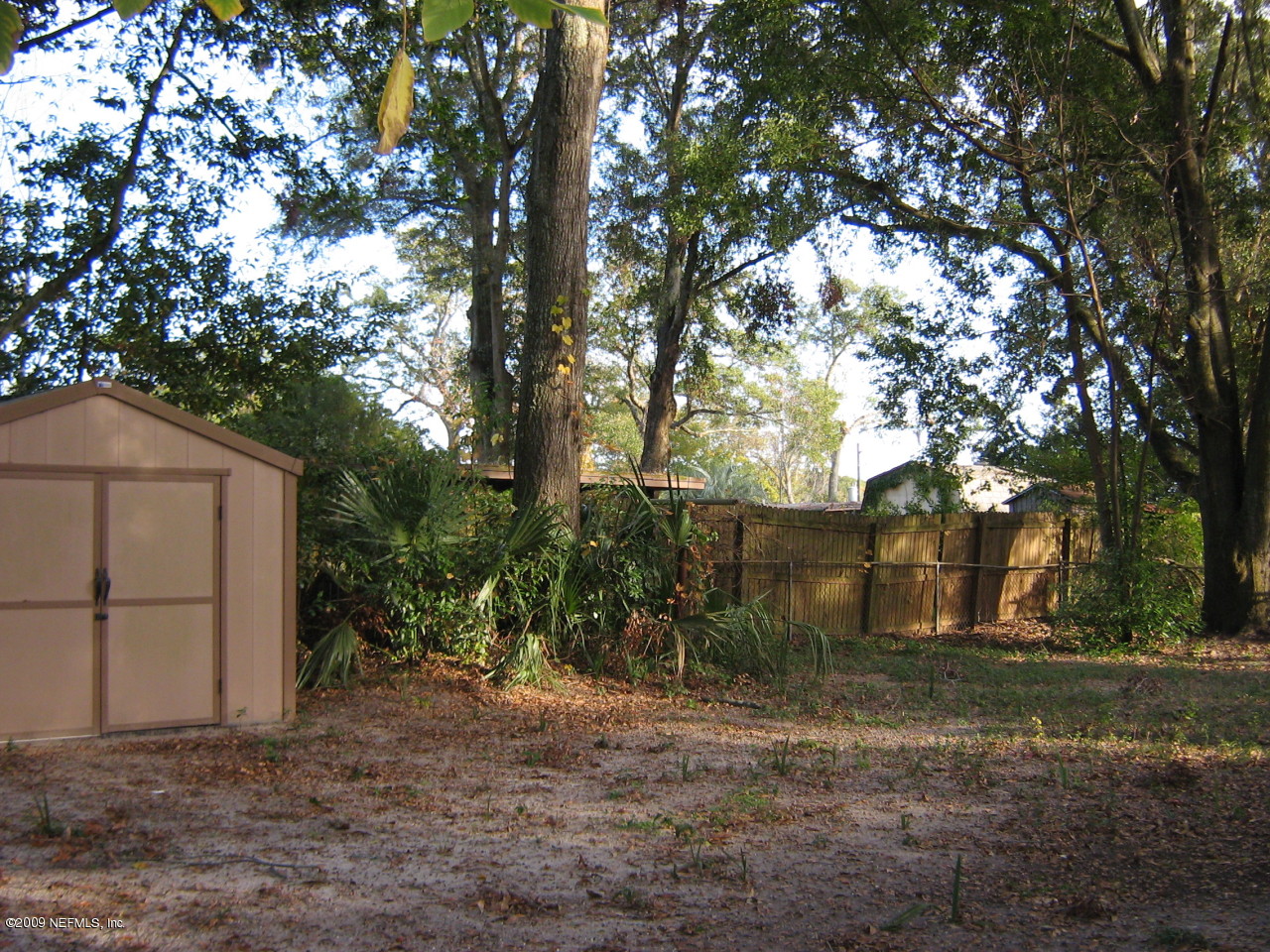 1341 Griflet Road Jacksonville, FL 32211 - Photo 3 of 8 a backyard of a house with lots of green space