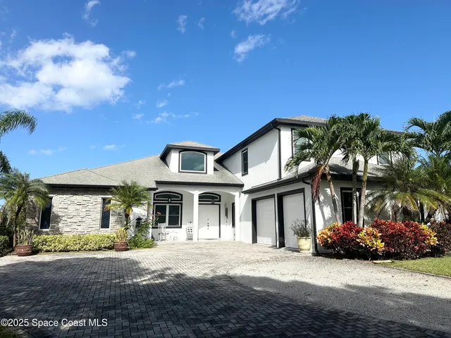 a view of a garden with a bench in the background