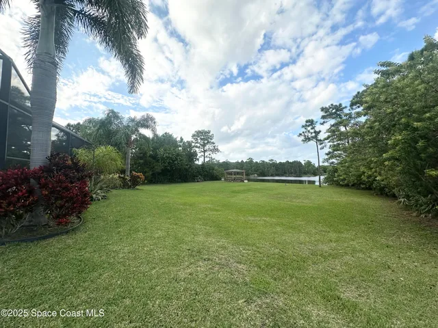 a kitchen with stainless steel appliances kitchen island granite countertop a refrigerator and a stove