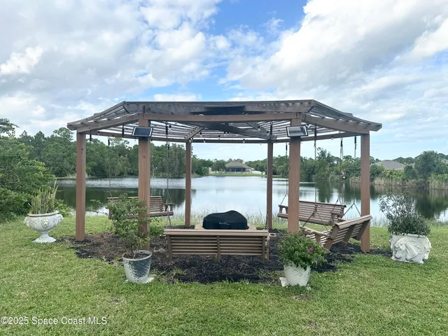 a kitchen with granite countertop stainless steel appliances stove sink and cabinets