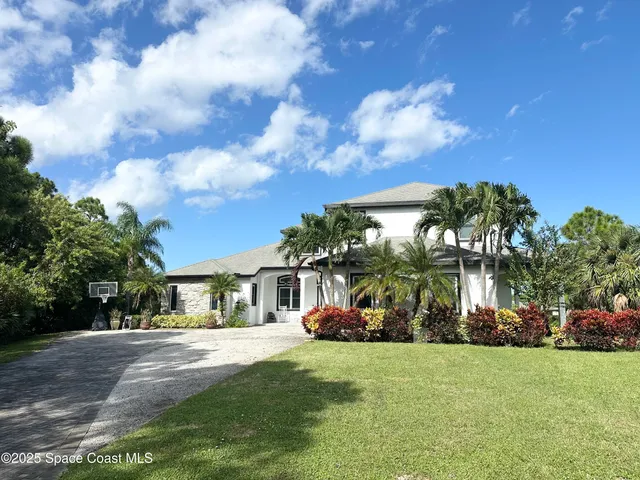 a backyard of a house with lots of green space