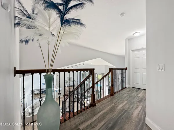 a living room with furniture a rug and a chandelier