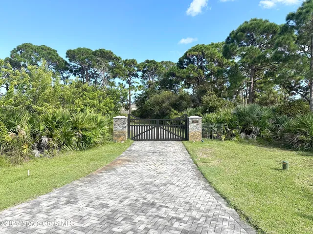 a kitchen with stainless steel appliances kitchen island granite countertop a refrigerator and a stove
