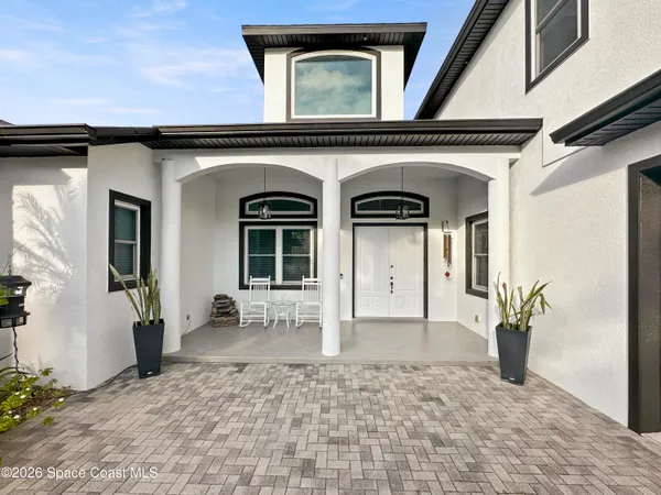 a work room with furniture and a chandelier