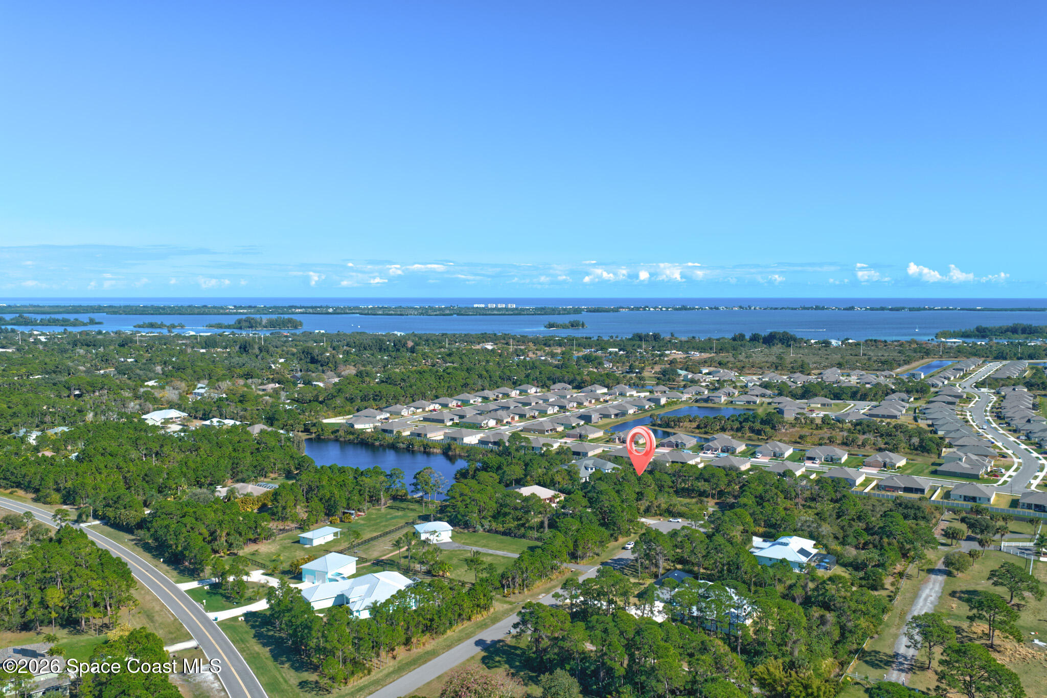 4762 Blossom Ridge Place Grant, FL 32949 - Photo 42 of 42 an aerial view of residential houses with outdoor space and trees