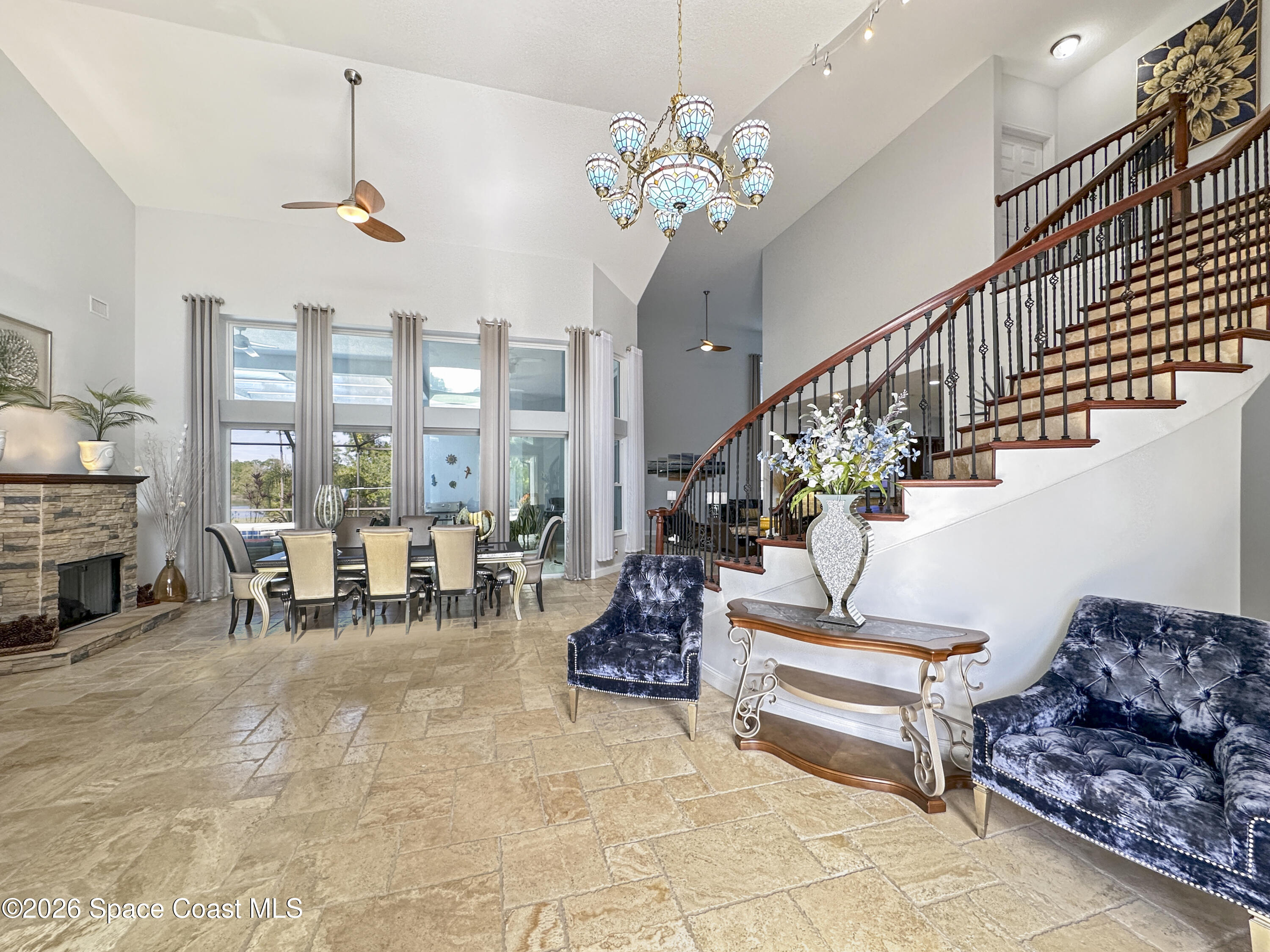 4762 Blossom Ridge Place Grant, FL 32949 - Photo 6 of 42 a living room with furniture and a chandelier