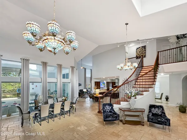 a kitchen with kitchen island granite countertop wooden cabinets and stainless steel appliances