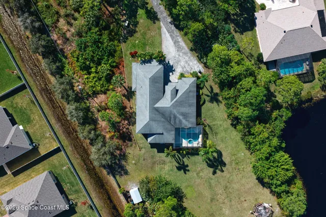 a living room with lots of furniture and a chandelier