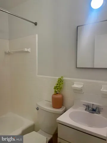 a bathroom with a shower and a bathtub