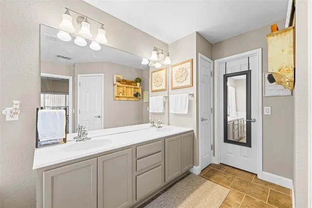 a bathroom with a tub and a view of living room