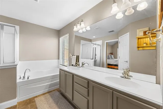 a bedroom with a bed and a table