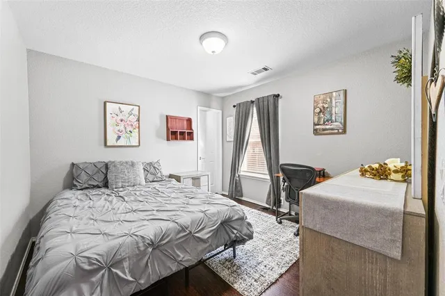 a bathroom with a sink a toilet and shower curtain