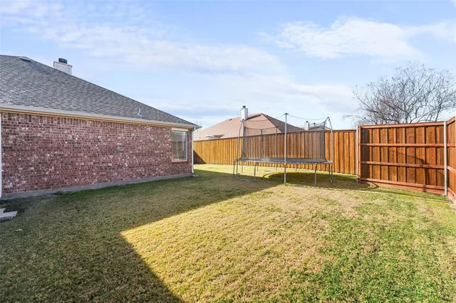 an aerial view of a house with pool and porch