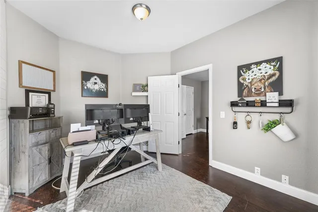 a view of a room with workspace and a window
