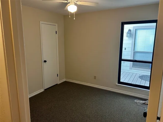 a white toilet and tub sitting next to a bathroom sink