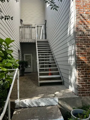 a view of a backyard with sitting area