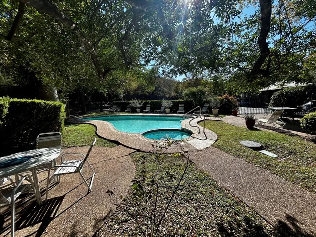 a view of a park with large trees