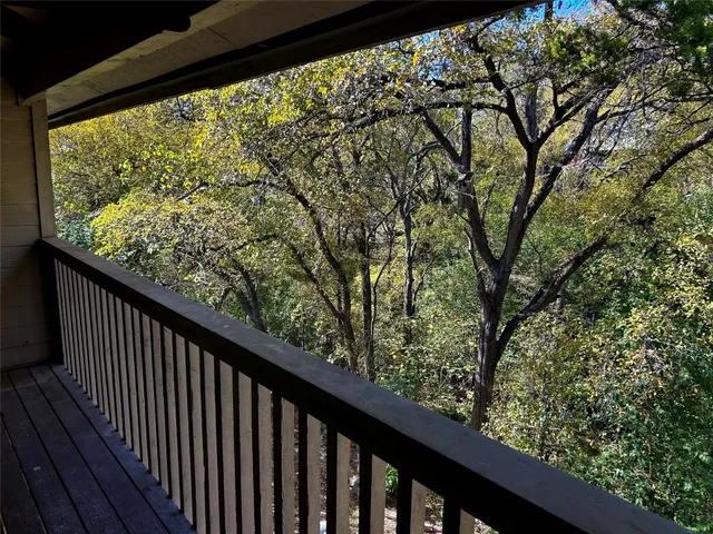 a view of balcony with wooden floor