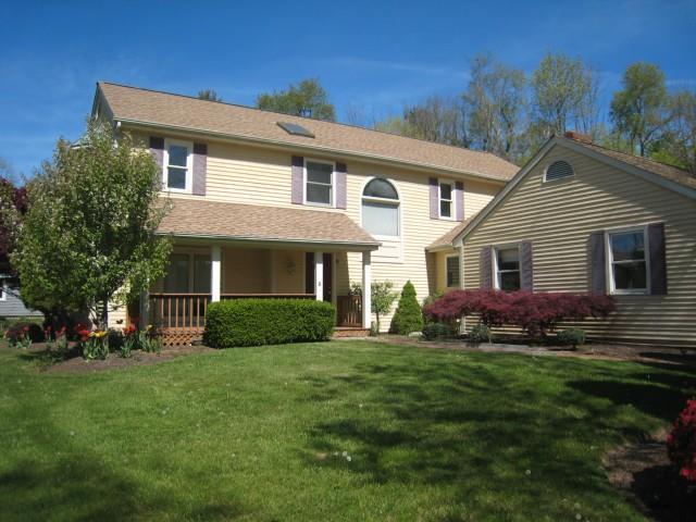 4 Hitching Post Lane Trumbull, CT 06611 - Photo 1 of 1 a front view of a house with a garden