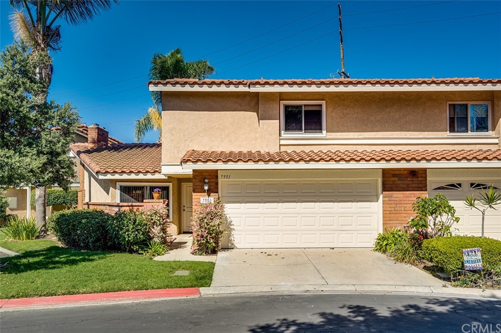 7951 Waterfall Circle Huntington Beach, CA 92648 - Photo 3 of 40 front view of a house with a yard