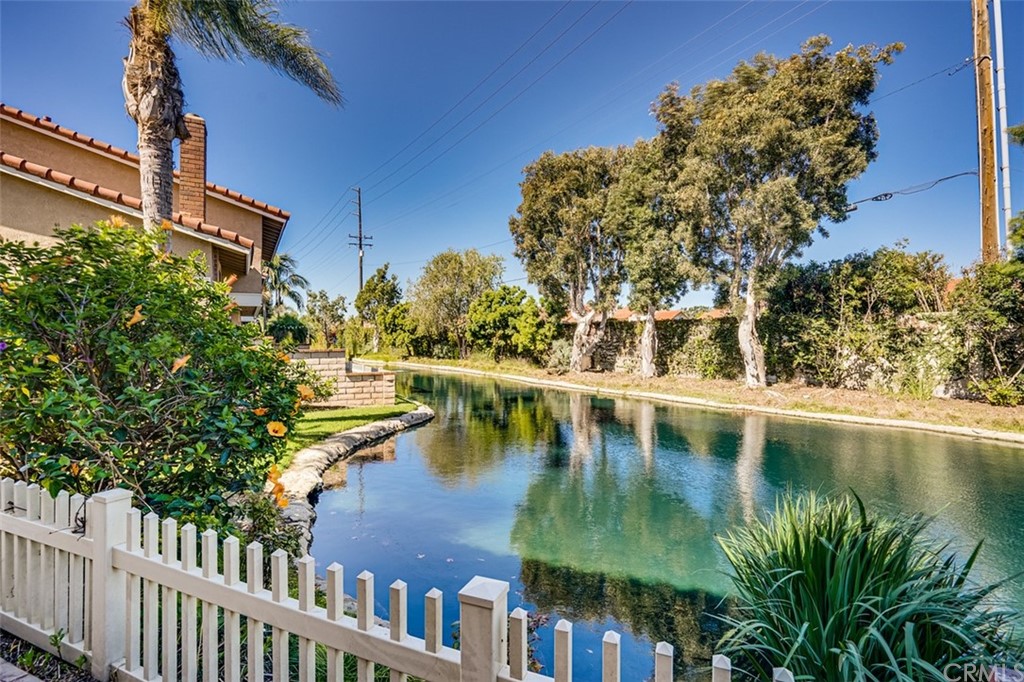 7951 Waterfall Circle Huntington Beach, CA 92648 - Photo 27 of 40 a view of swimming pool with outdoor seating and lake