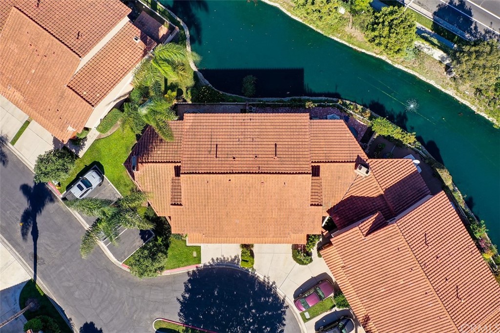 7951 Waterfall Circle Huntington Beach, CA 92648 - Photo 37 of 40 an aerial view of a house with a yard and lake view
