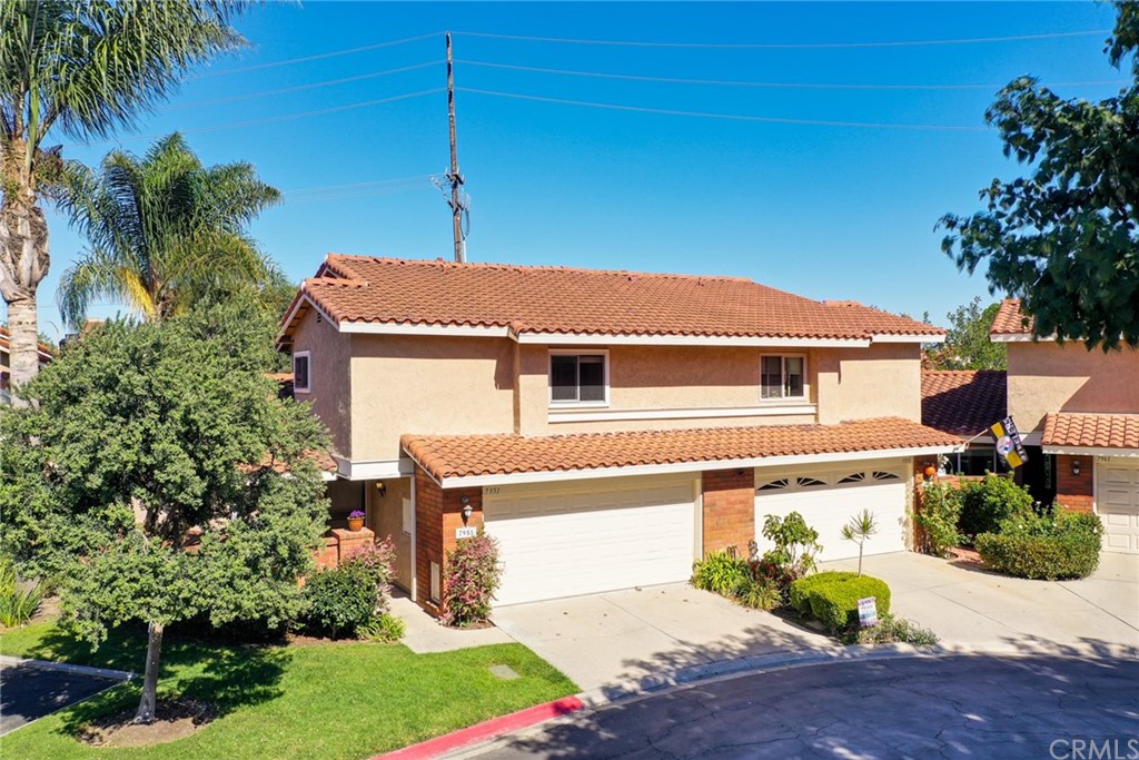 7951 Waterfall Circle Huntington Beach, CA 92648 - Photo 6 of 40 a front view of a house with a yard