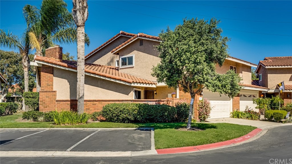 7951 Waterfall Circle Huntington Beach, CA 92648 - Photo 7 of 40 a front view of a house with a yard