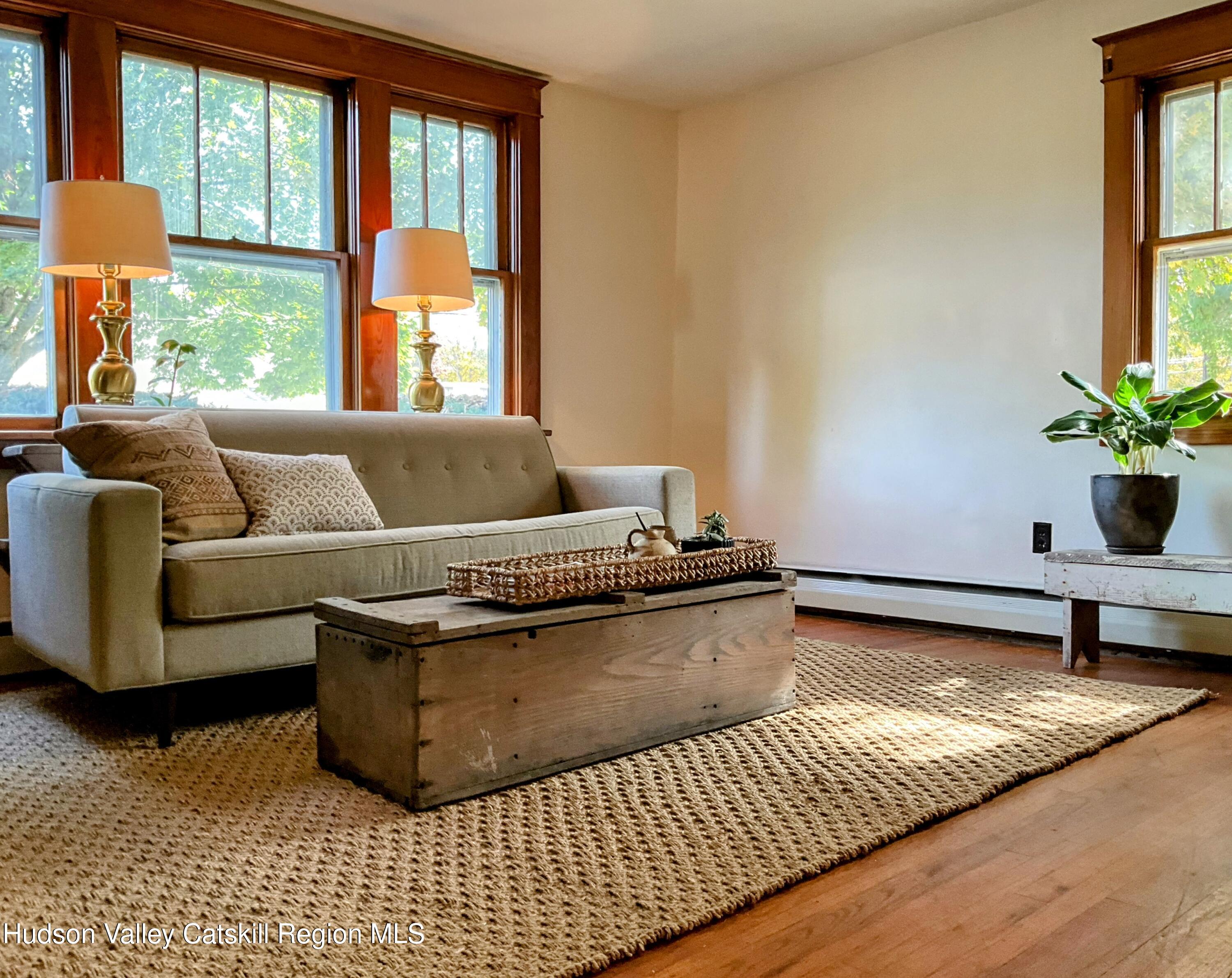 729 Springtown Road Tillson, NY 12486 - Photo 11 of 52 a living room with furniture and a potted plant