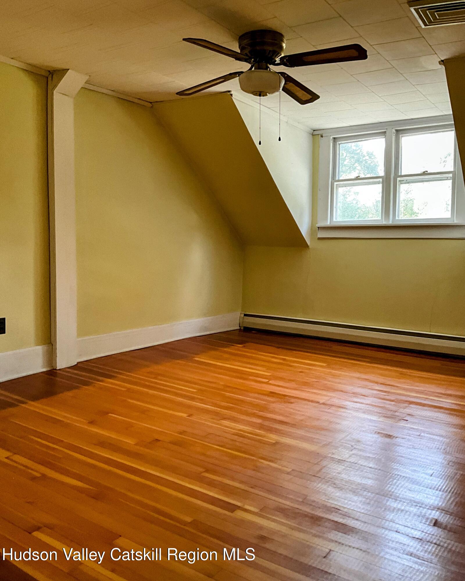 729 Springtown Road Tillson, NY 12486 - Photo 24 of 52 a view of a room with wooden floor and white walls